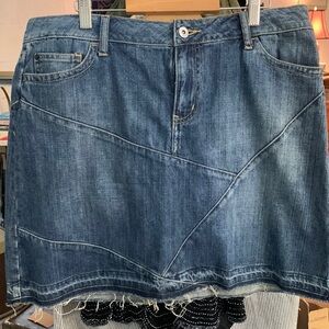Size 10 Noir skirt in patchwork denim with front pockets and a tiny zip